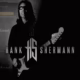Photo of Hank Shermann holding a guitar.